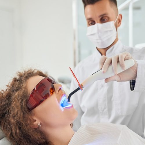 Patient receiving painless laser dental treatment at Dr. Panjiar’s Dental Clinic, the best dental clinic in Hadapsar.